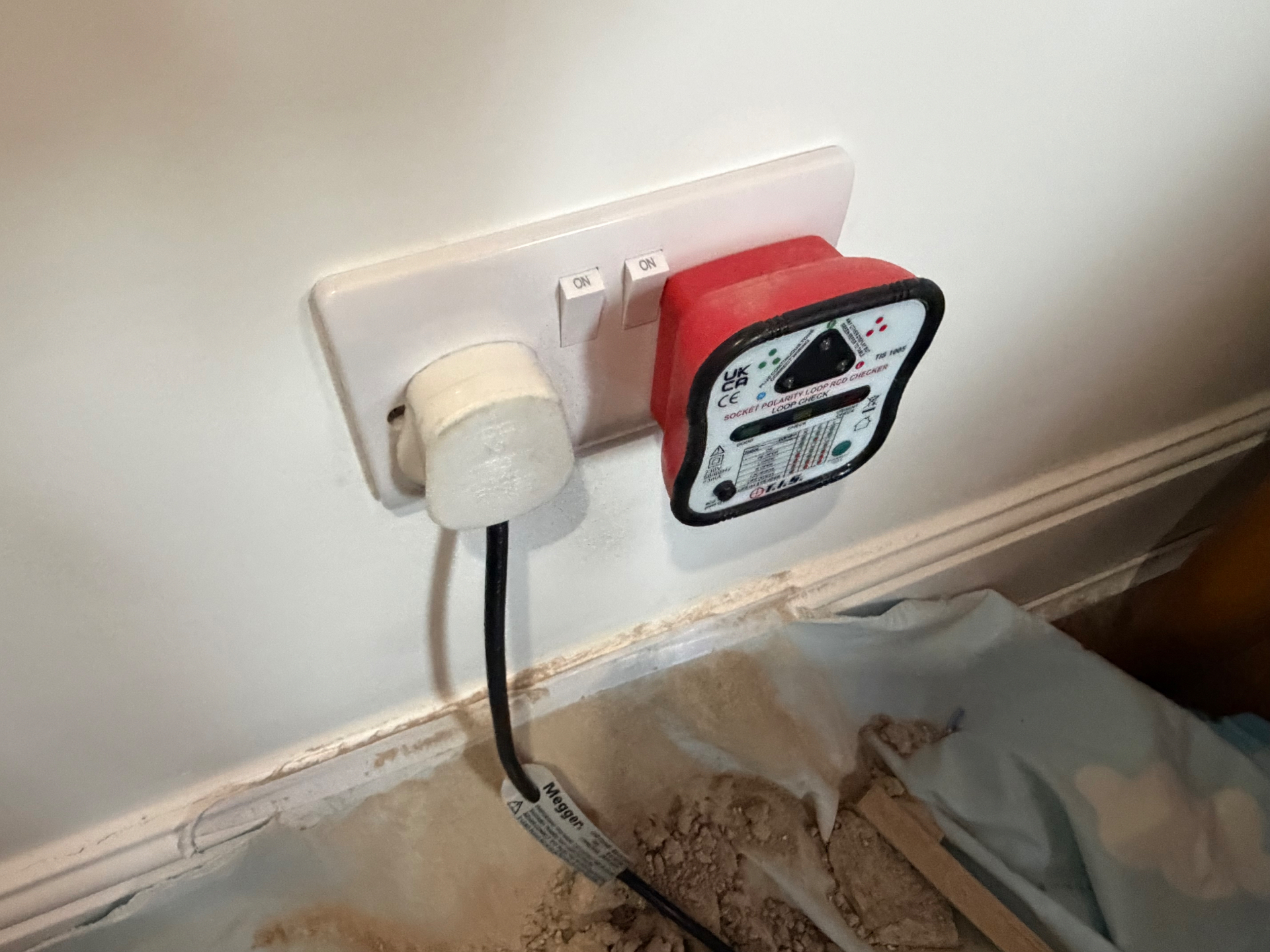 TIS 1005 loop/RCD checker plugged into the new socket for a live loop test